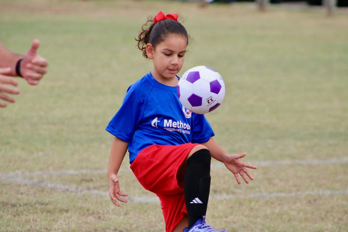 Niños participan en una sesión de fútbol juvenil de San Antonio City SC.