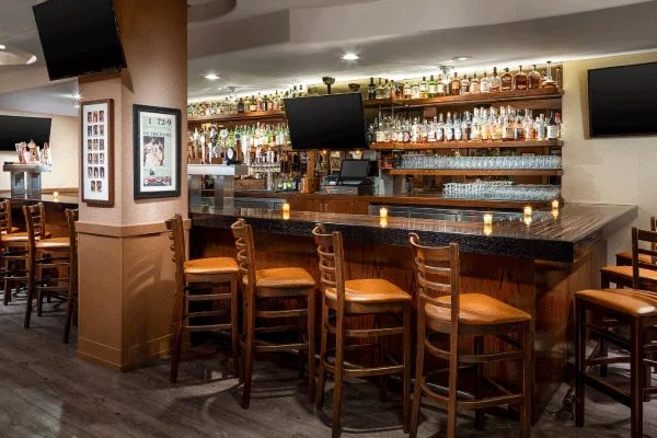 Bar seating and dining area at Jasper’s Corner Tap & Kitchen. Source: https://visittenderloin.com/wp-content/uploads/2024/11/jaspers2.png