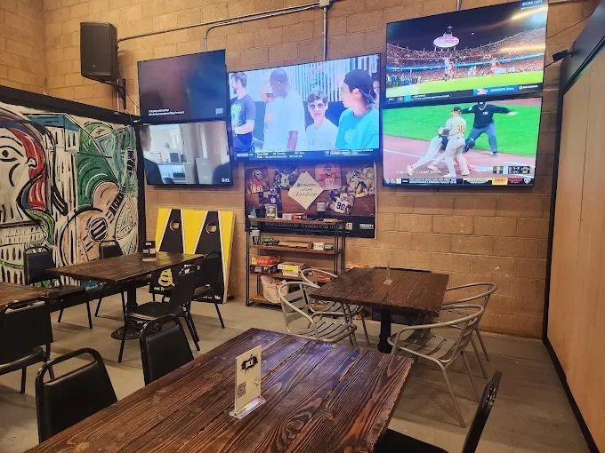 BRÜE CRÜE taproom interior with televisions and tables Source: https://assets.cdn.filesafe.space/vPcbyvnjJwy8YHfUuB1D/media/6a0d3733f18a99d94862a1db.jpg