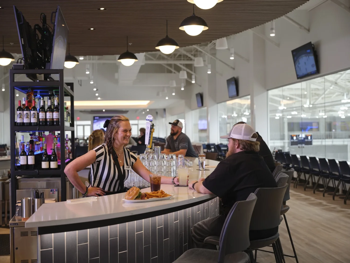 Dining and game-viewing area at Puck’s Sports Bar Source: https://images.squarespace-cdn.com/content/v1/64386a8af9be8871deece8df/1716915257064-NDLDKCS9SIUNORV2ZJBD/WeStreet-035.jpg?format=1500w