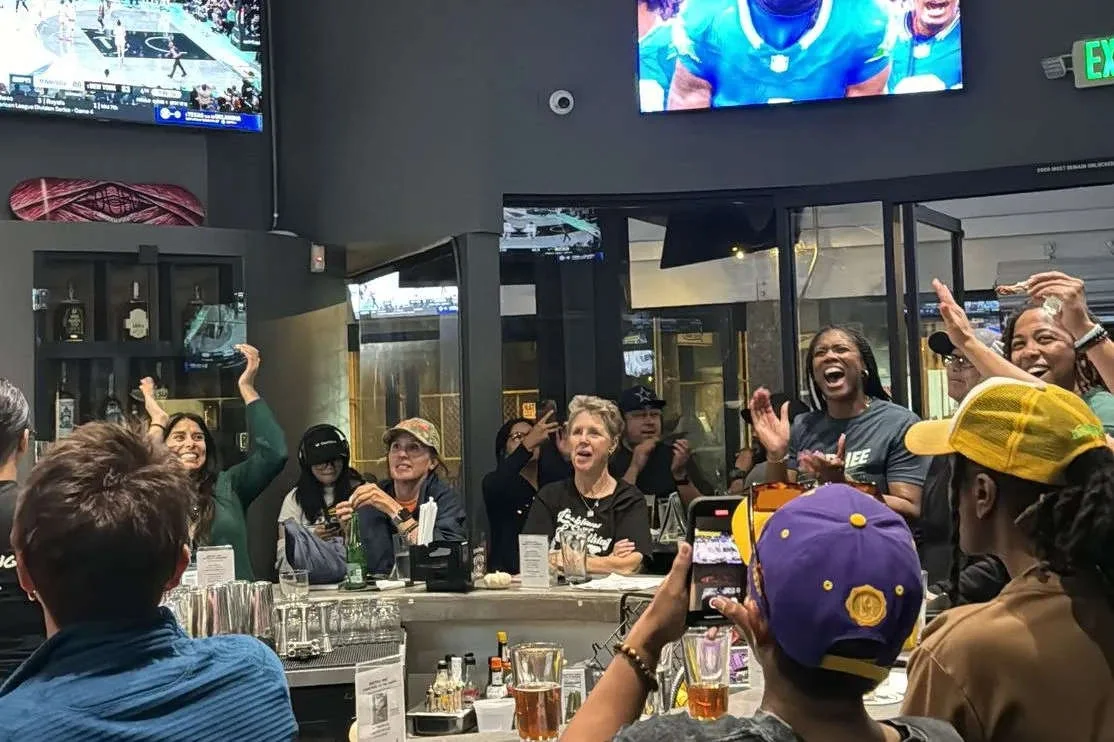Guests watching sports at Watch Me! Sports Bar in Long Beach. Source: https://ik.imagekit.io/67ng46hjy/tr:f-auto/v0/b/gametimehero-prod.appspot.com/o/websites%2Fn6FDejdkLxXsdmCb5MnKVk5FMht2%2Fdcaf0f24-c403-4c54-85a7-b65cba90eed9%2F1774196656901_Fans---Web