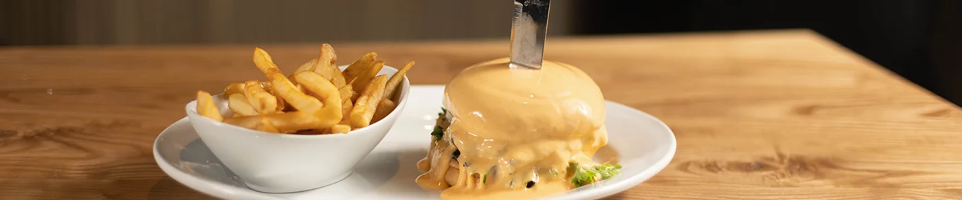 Food served at Sports & Social Dolphin Mall. Source: https://edge.sitecorecloud.io/cordishc-4m5nplkf/media/District-Websites/Dolphin-Mall/Eat-and-Drink/Sports-and-Social/Menu-Items/SS-Dolphin-Handhelds-1440x300.jpg