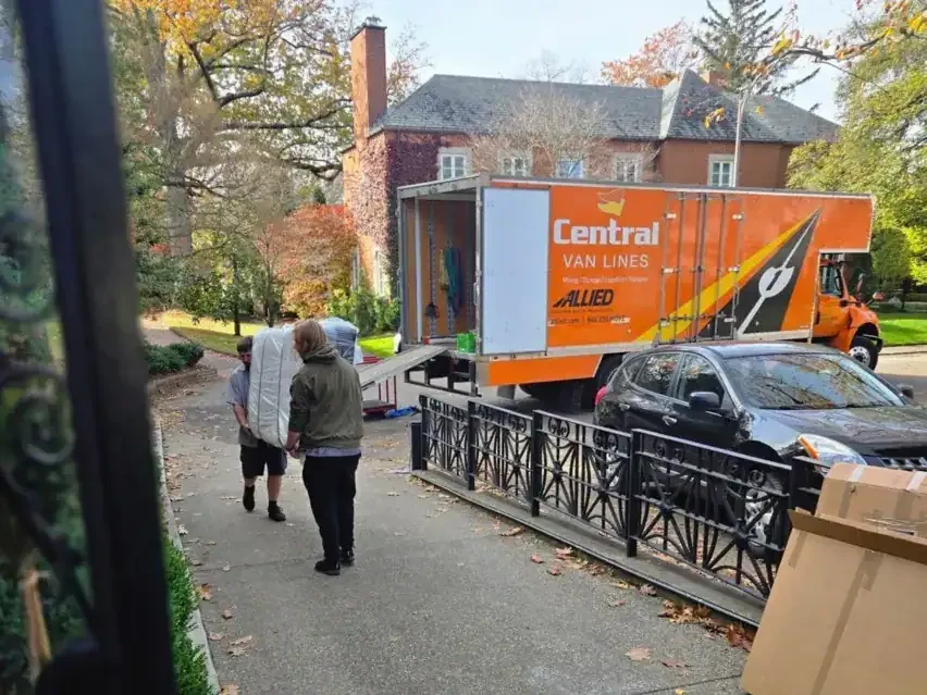Central Van Lines truck loading at a residential home.