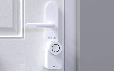 Smart lock installed on a white entry door