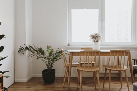 Dining furniture display with a wooden table and chairs.