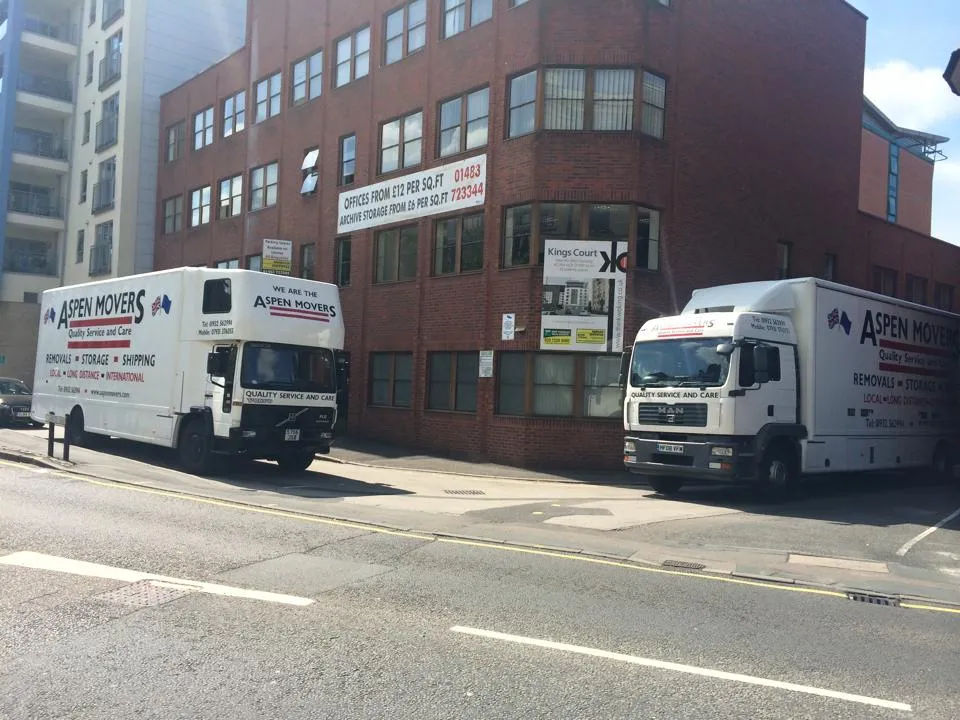 Two Aspen Movers trucks outside the company's Weybridge premises.