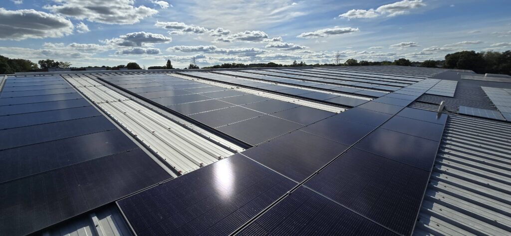 A large solar panel array installed on a commercial rooftop.