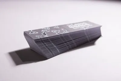 A stack of freshly printed business cards.