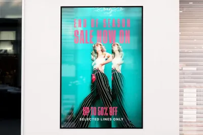 A printed promotional poster displayed indoors.