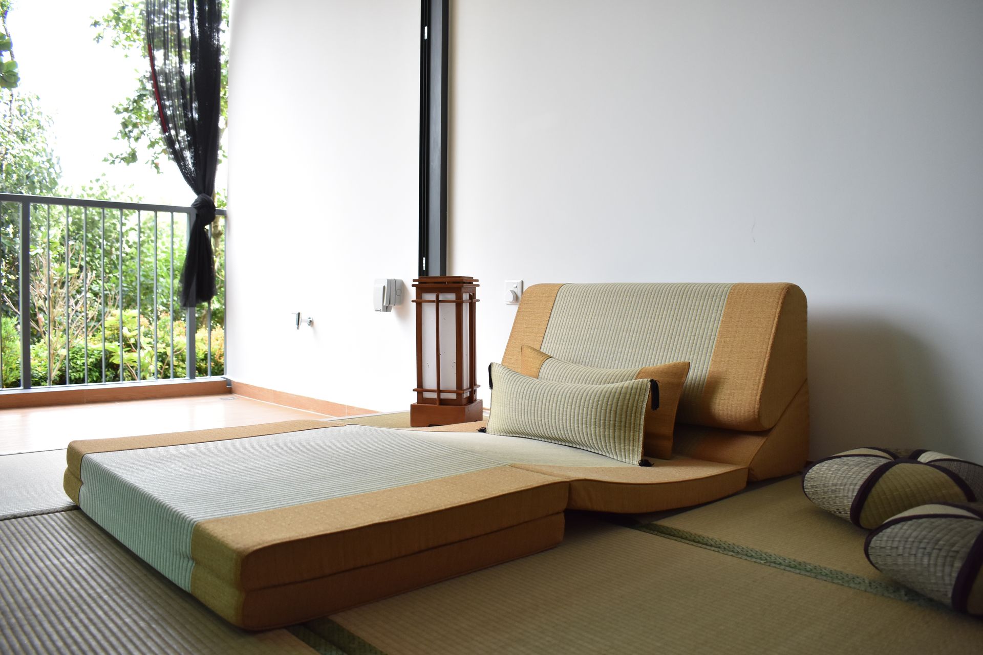 Tatami platform bed and seating in a Japanese-style room.