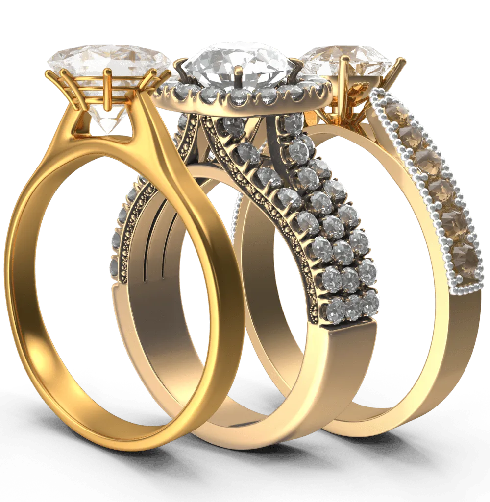 Gold and diamond rings displayed against a light background.