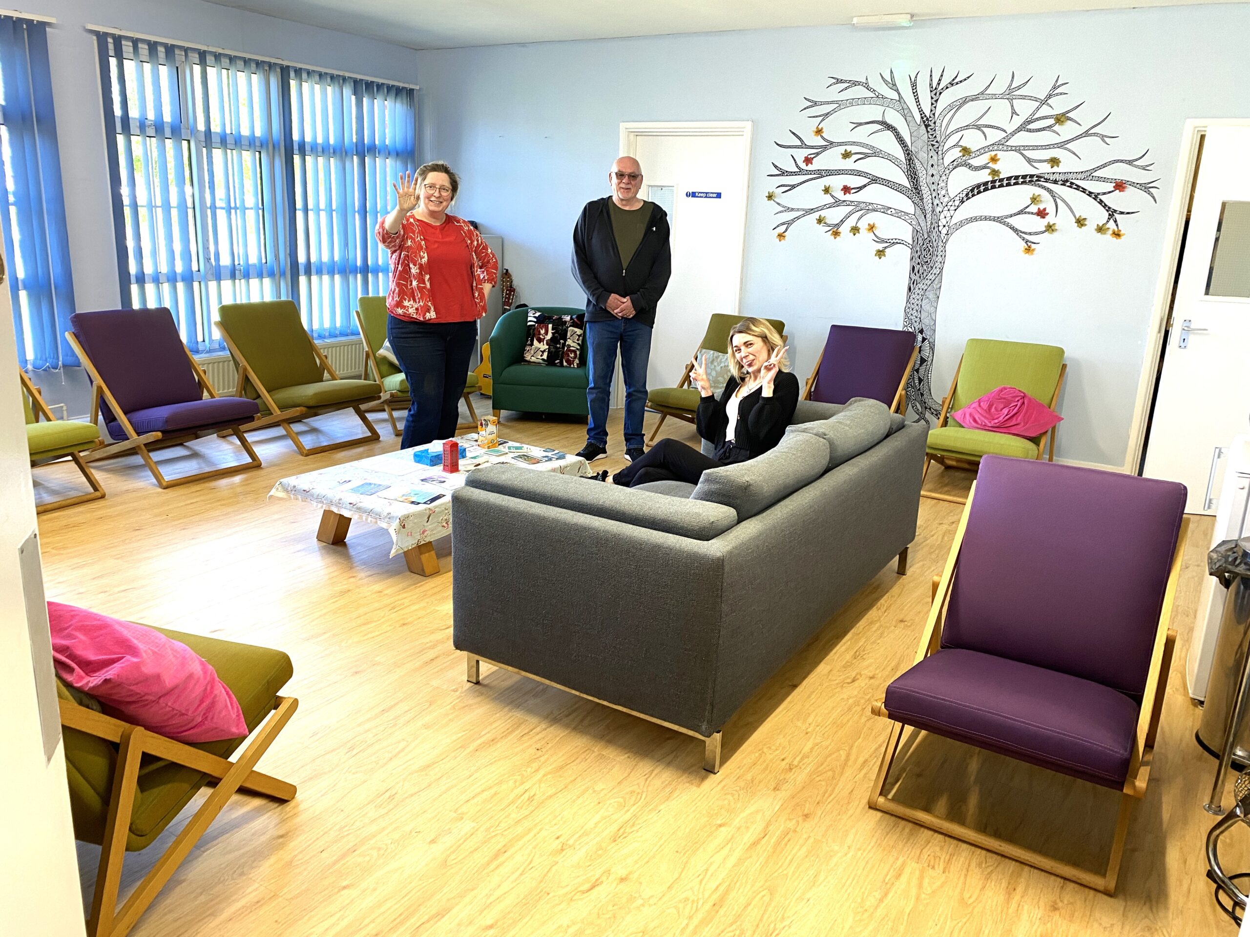 Refurbished office sofas and chairs arranged in a bright room