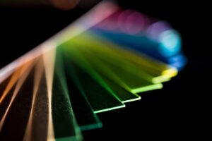 Edges of transparent acrylic sheets in multiple colors