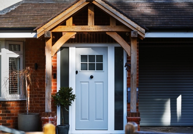 A white front door and windows at a home