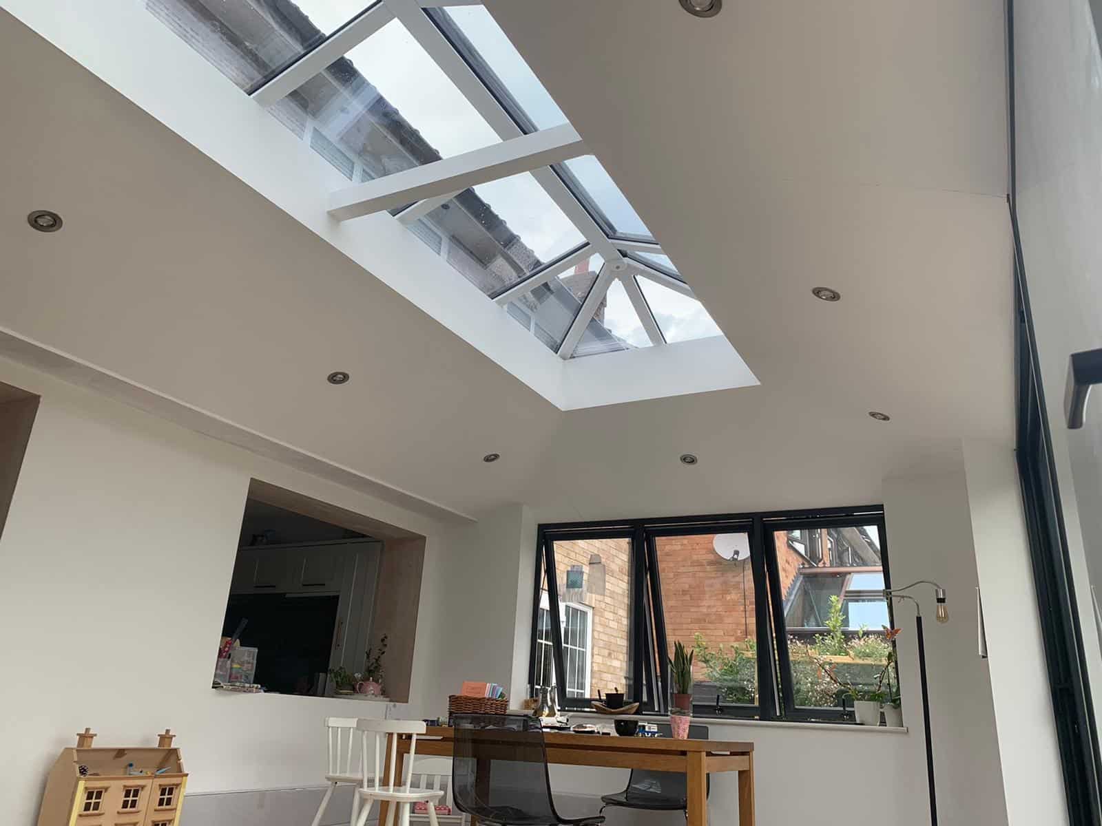 Bright interior beneath a glass-roof orangery