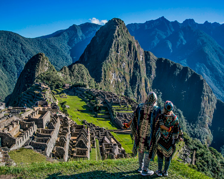 Travellers overlooking Machu Picchu in the Andes