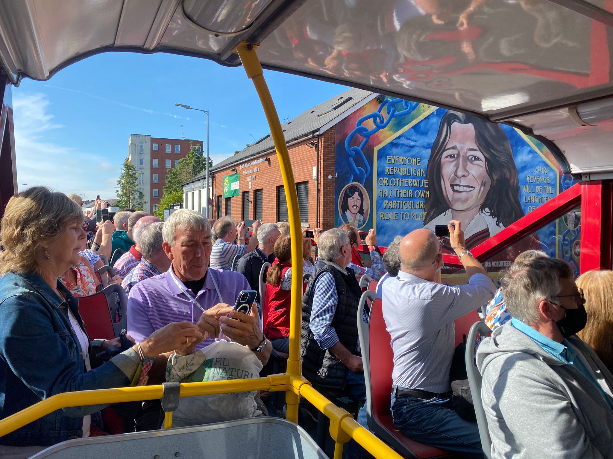Passengers on a Belfast sightseeing bus