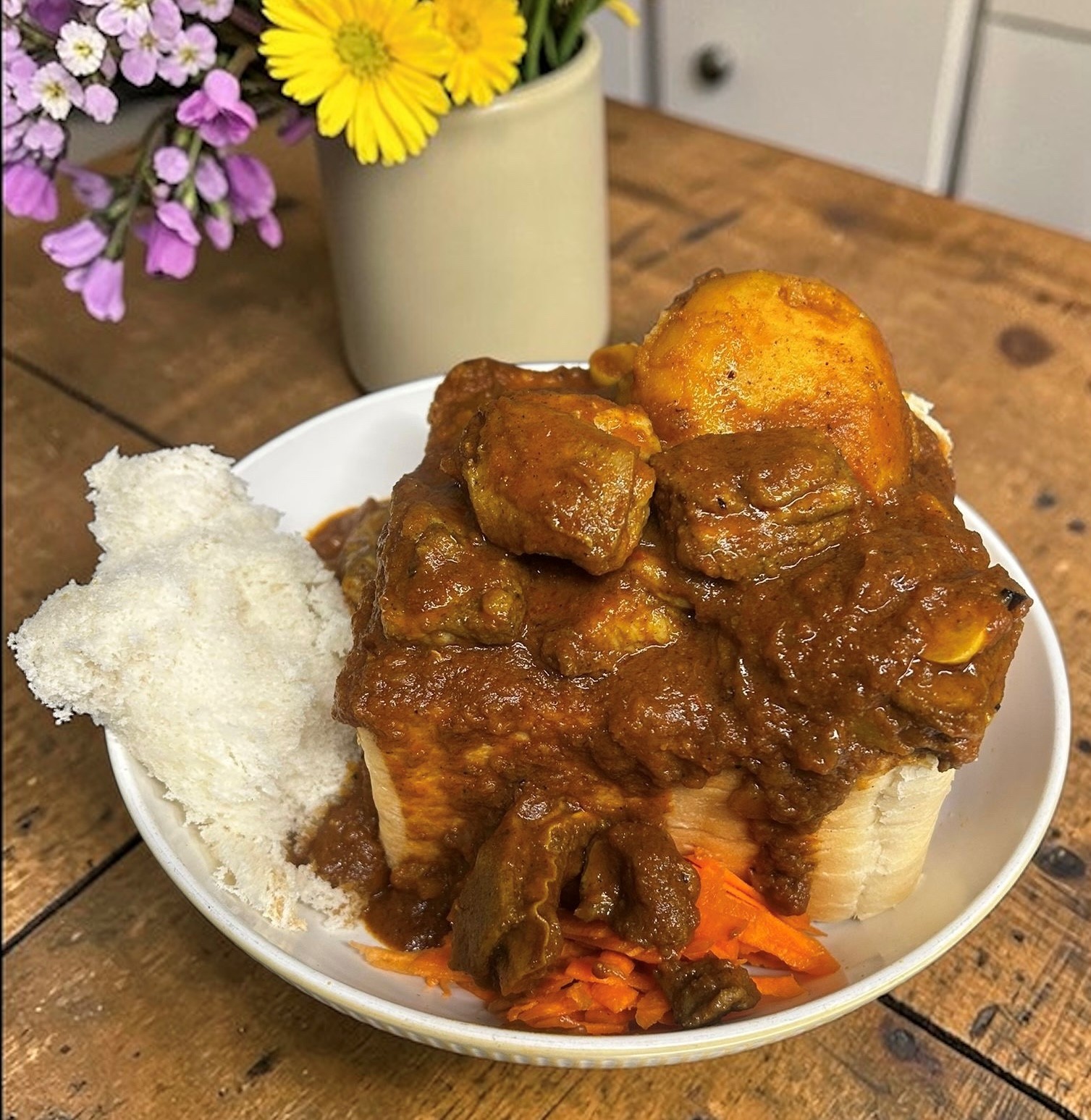 Durban bunny chow curry dish shown by Bunny UK