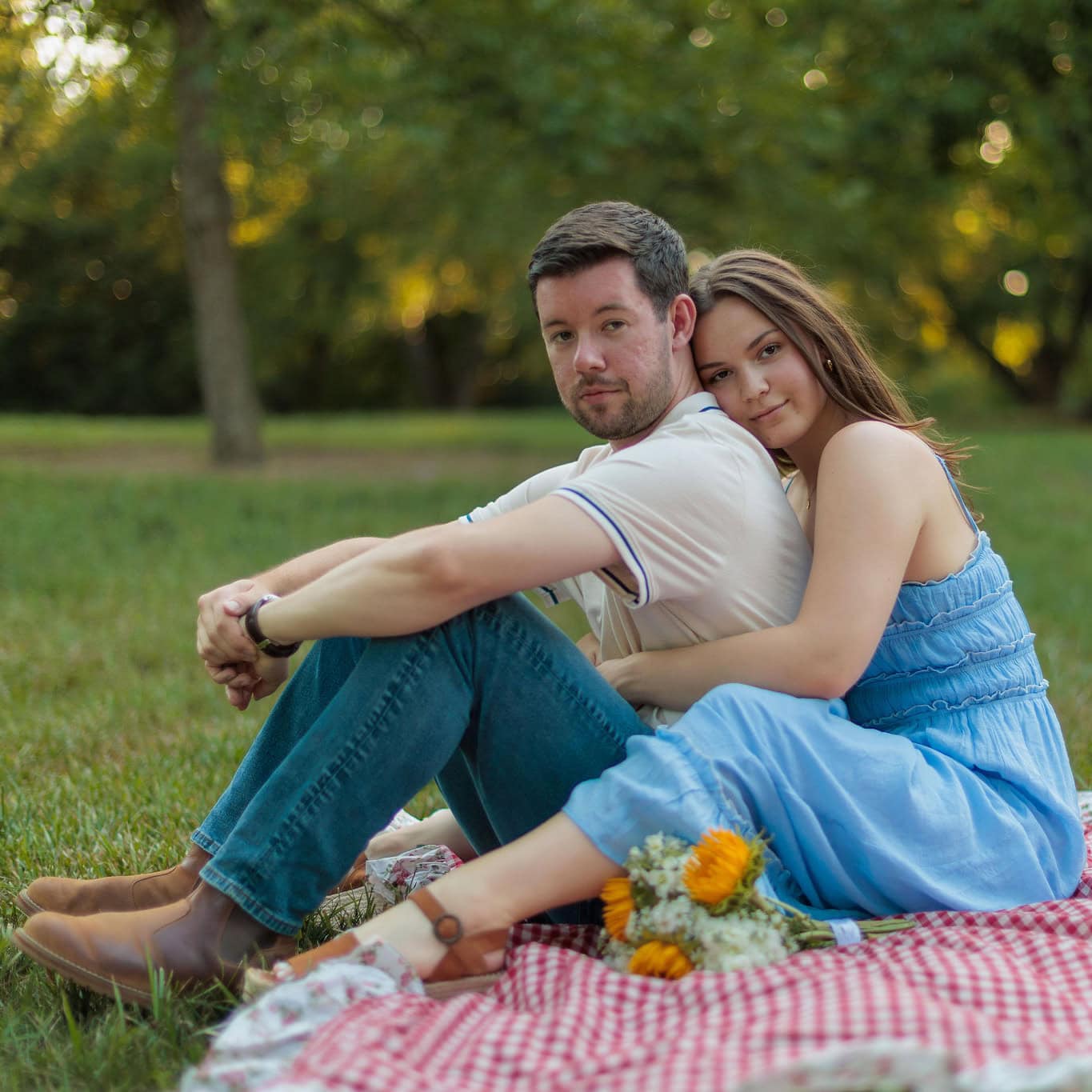 A couple photographed outdoors