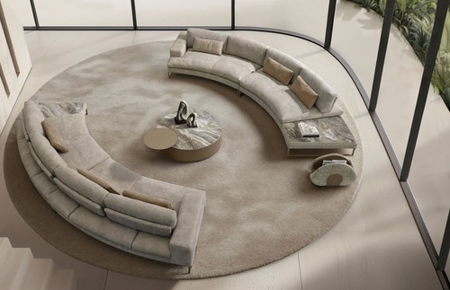 Curved living-room sofa displayed in a bright interior