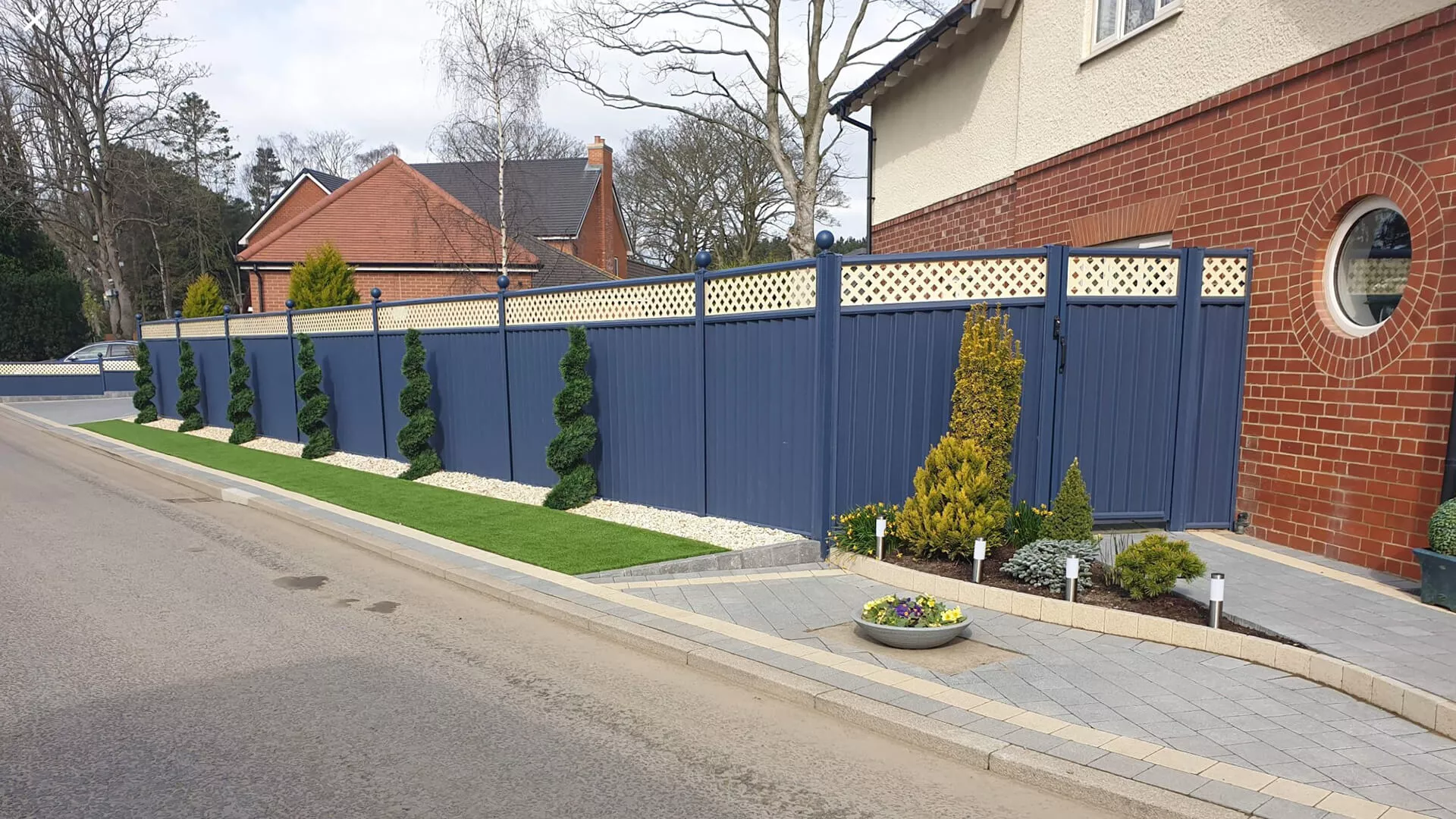 Blue ColourFence steel fence and gate installed beside a house