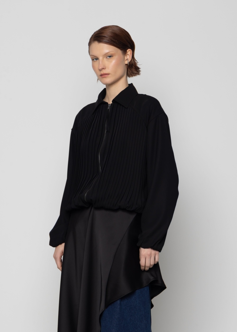 Model wearing a black outfit from ESTHE