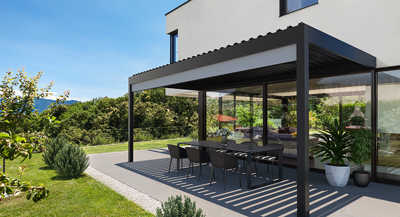 External pergola shading a patio beside a house