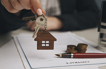House keys and property paperwork illustrating real estate training