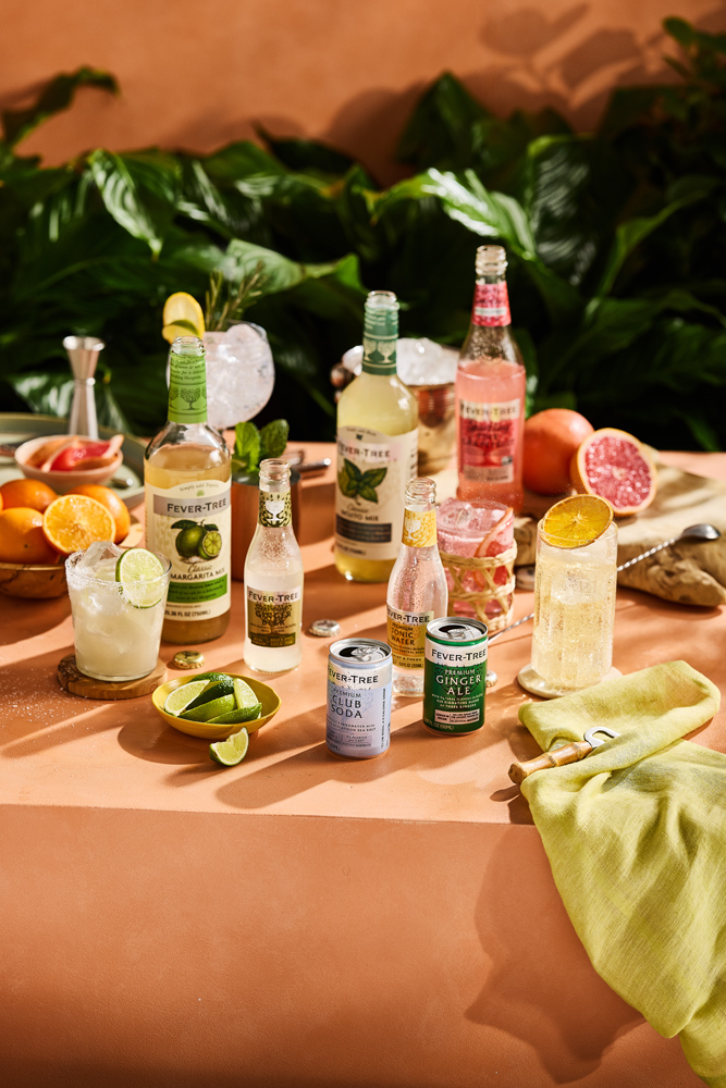 Fever-Tree mixer bottles and cans with prepared drinks