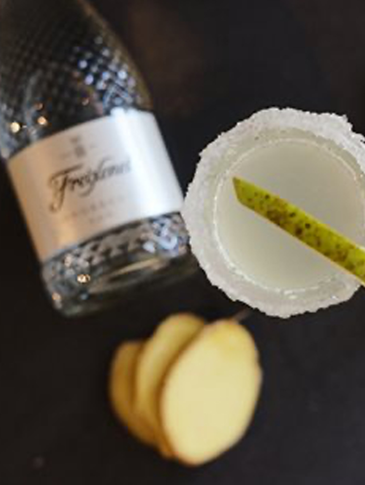 Freixenet sparkling wine beside a prepared drink