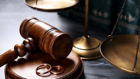 Gavel, scales and wedding rings illustrating legal services
