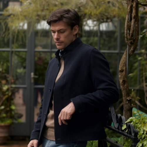 Man wearing a dark Magee jacket outdoors