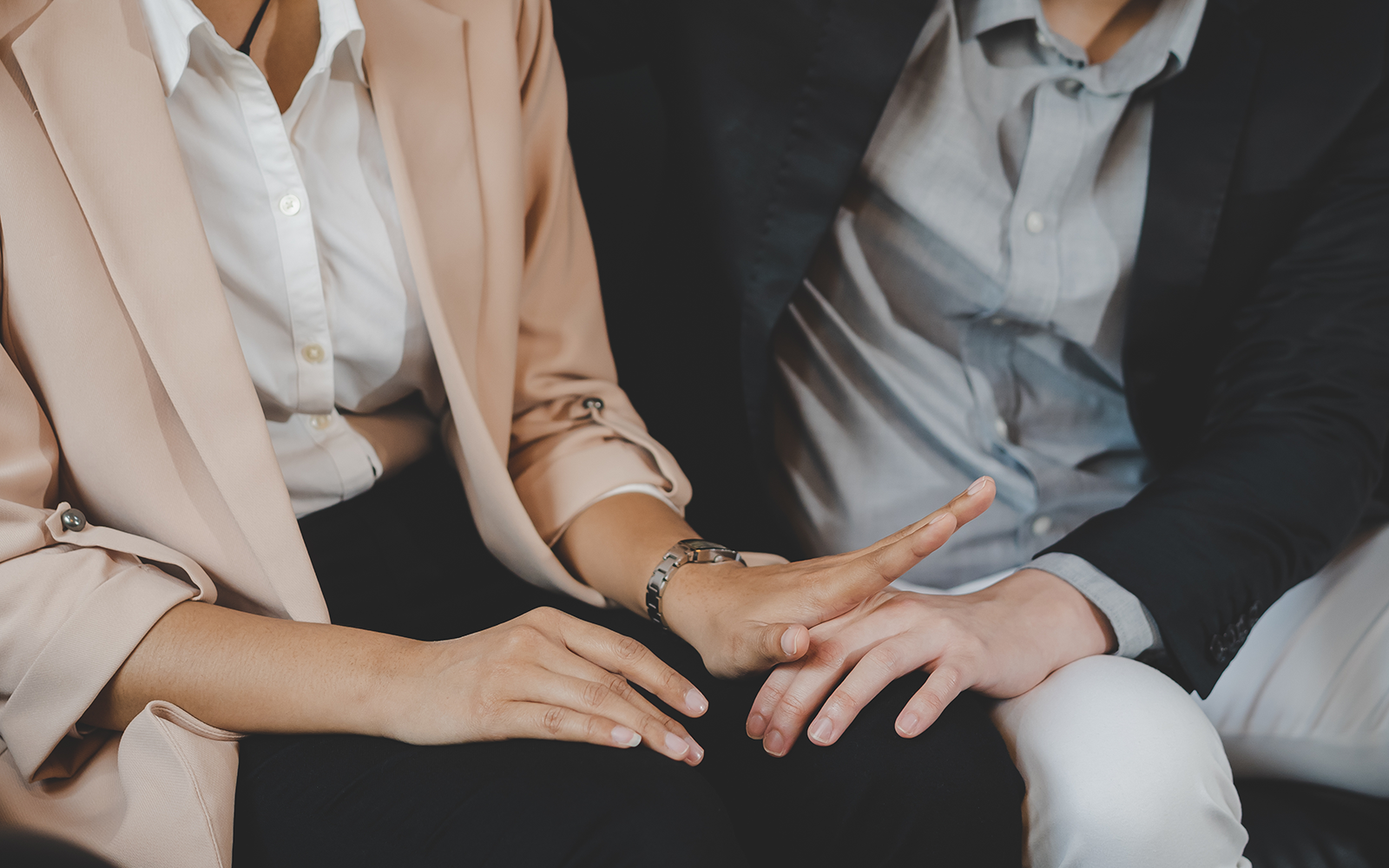 People discussing a matter around a table