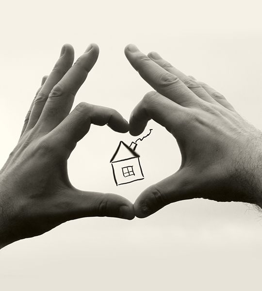 Hands exchanging a house key