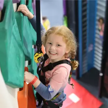 Child climbing an indoor wall at Rock Up