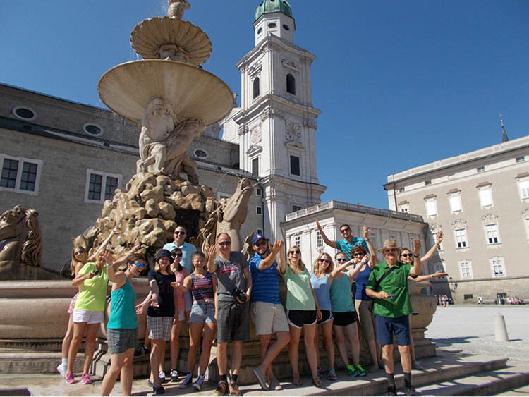 Tour participants by a Salzburg fountain