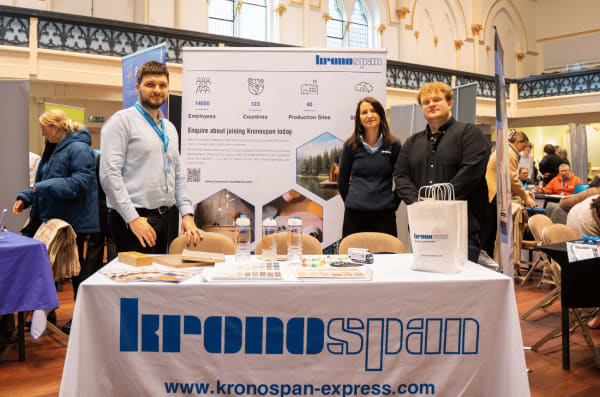 Exhibitors speaking with visitors at a careers fair