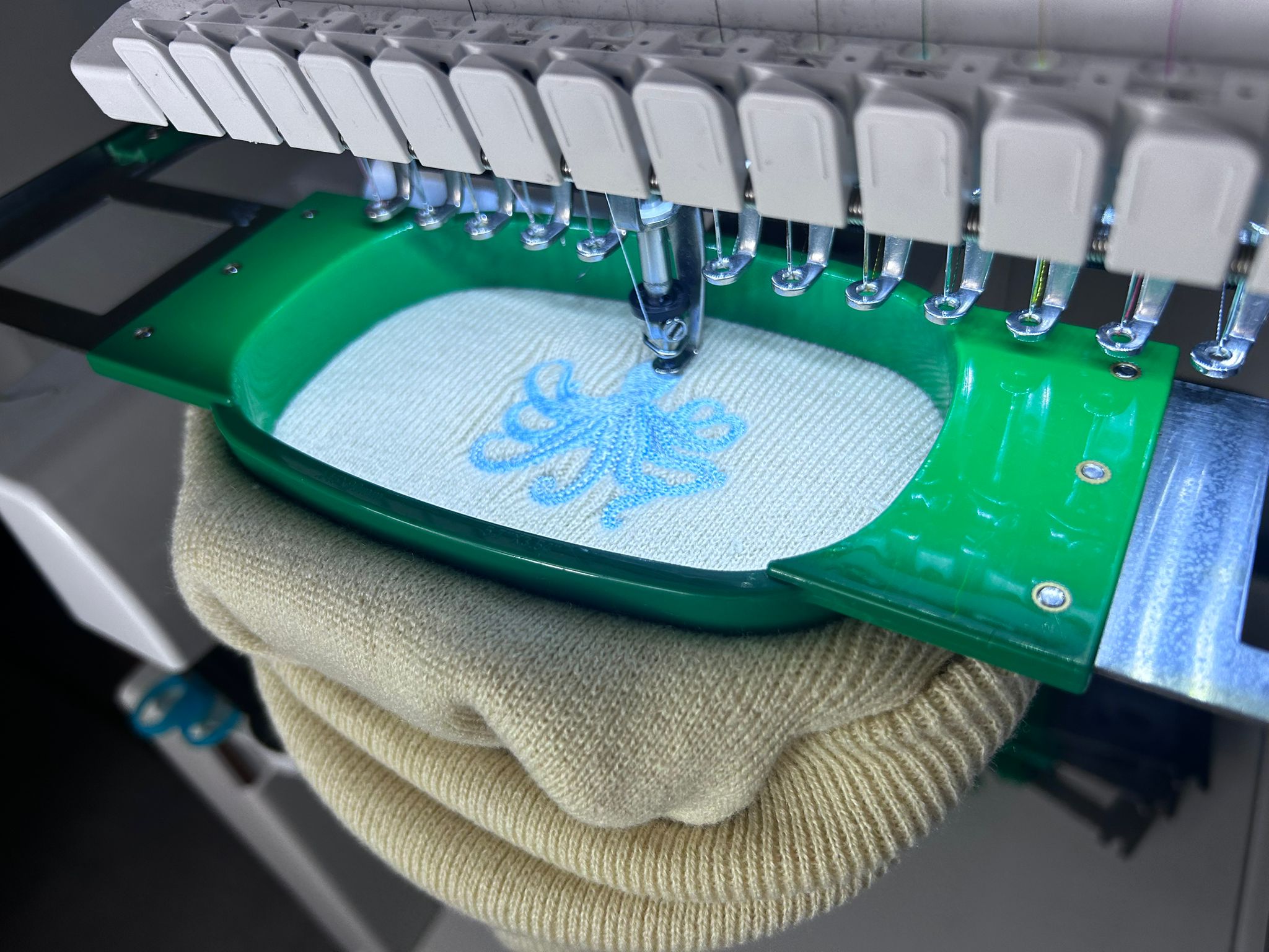 An embroidery machine stitching a design