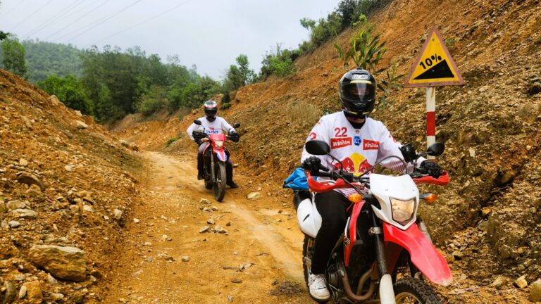 Motorcyclists riding on a rural trail