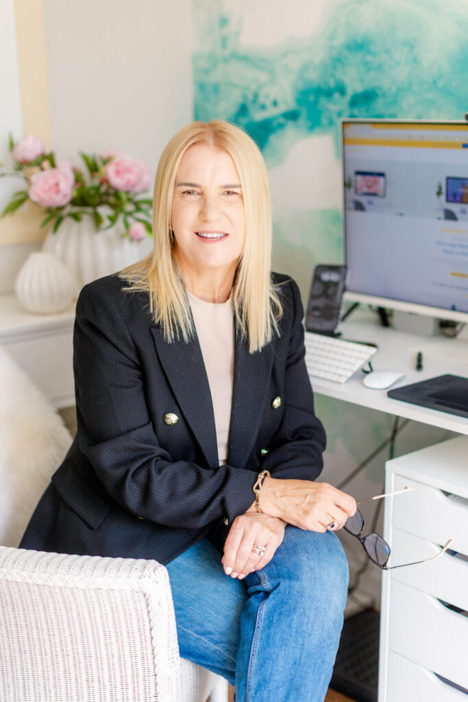 Designer seated beside a computer